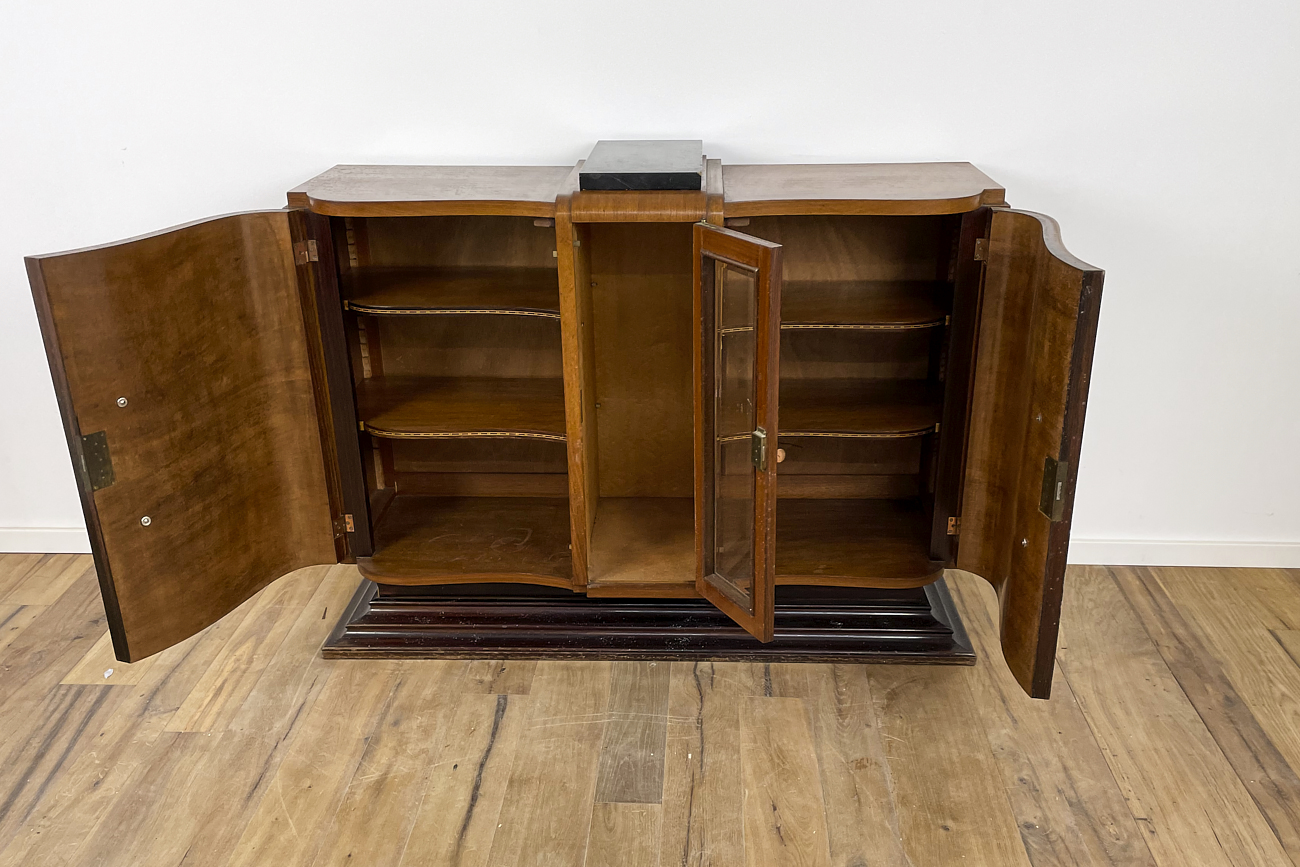Art Deco chest of drawers in rosewood veneer with glass handles from France around 1925 with a display case