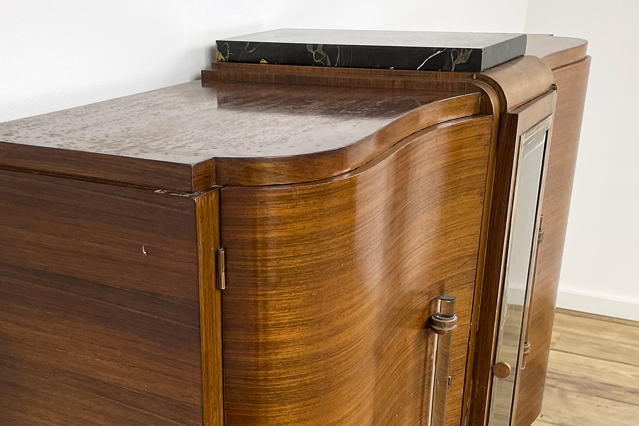 Art Deco chest of drawers in rosewood veneer with glass handles from France around 1925 with a display case