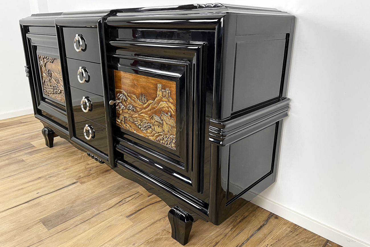 Art Deco sideboard around 1930 with two carved paintings
