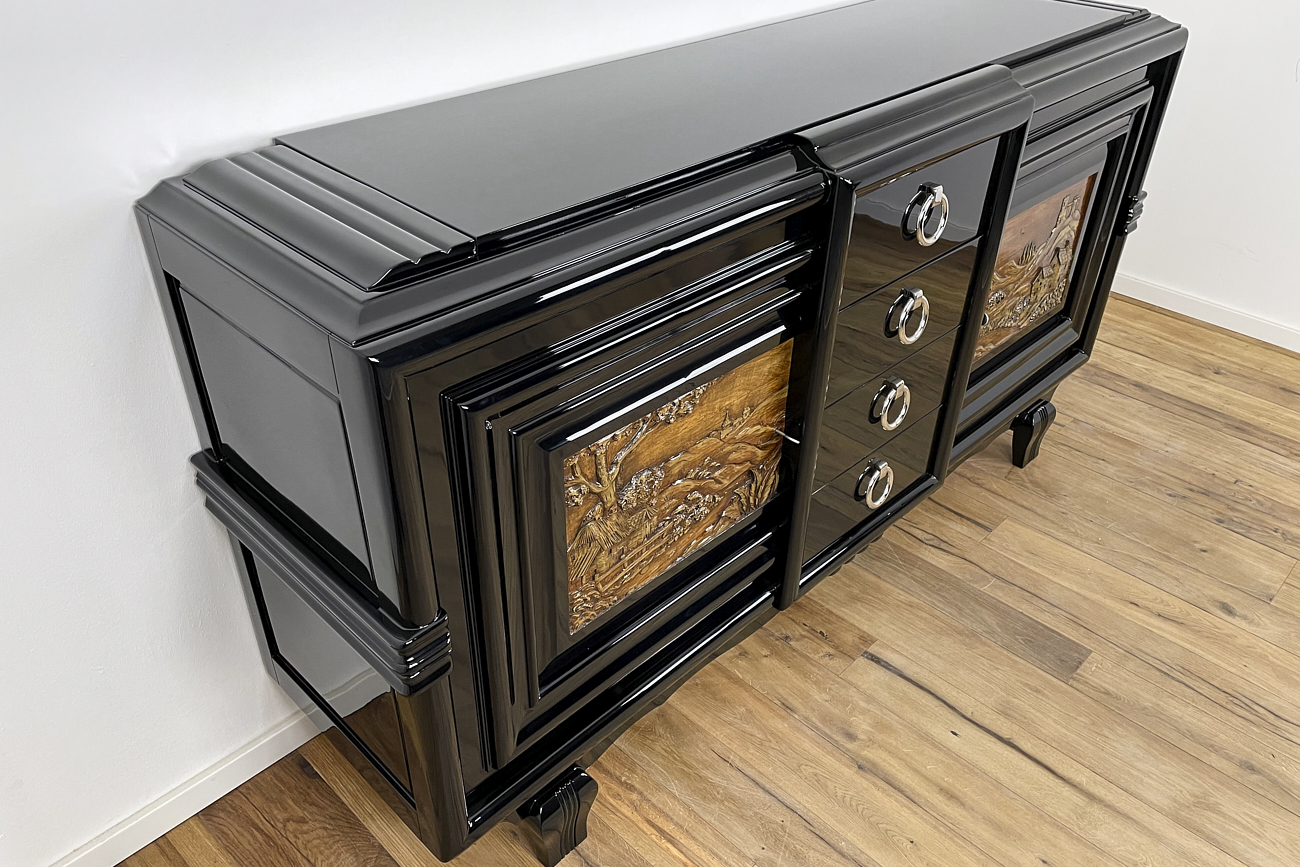 Art Deco sideboard around 1930 with two carved paintings