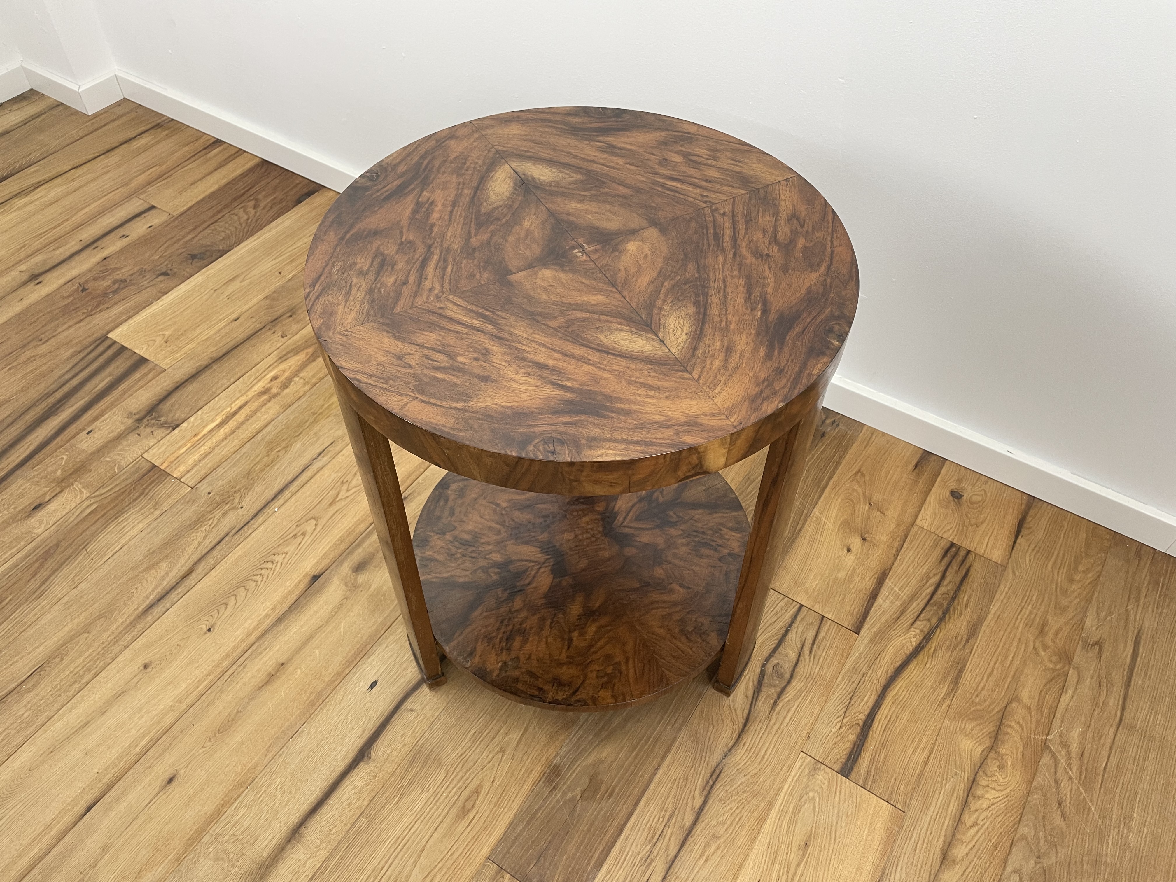 Art Deco side table with fantastic walnut veneer on three legs from near Paris around 1925