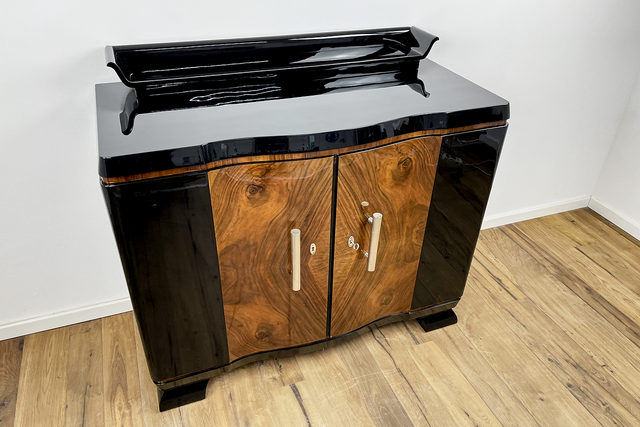 Art Deco chest of drawers from Germany around 1930 in black high gloss and walnut